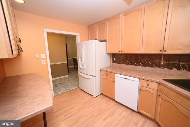 kitchen with white appliances, light wood-style flooring, light countertops, and light brown cabinetry