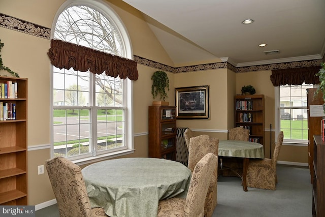 carpeted dining space featuring recessed lighting, lofted ceiling, visible vents, and baseboards