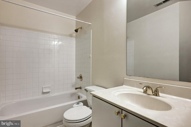 bathroom with vanity, toilet, shower / tub combination, and visible vents