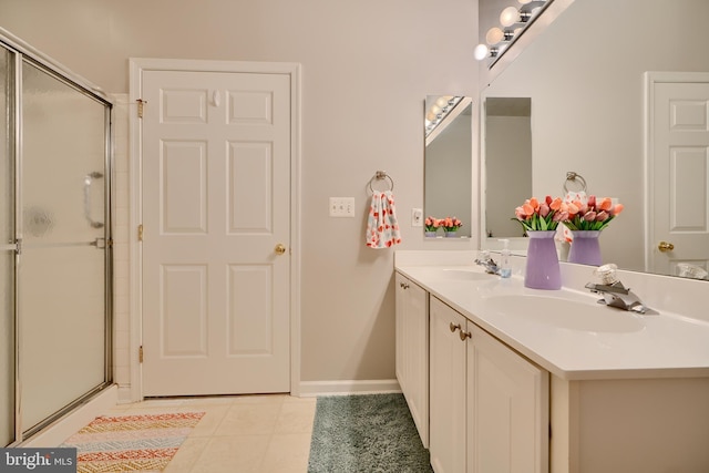 full bath featuring tile patterned floors, a sink, and a shower with shower door