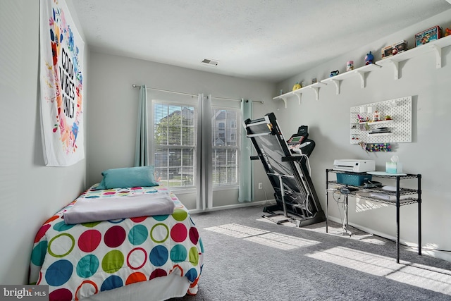 bedroom featuring carpet floors, baseboards, and visible vents