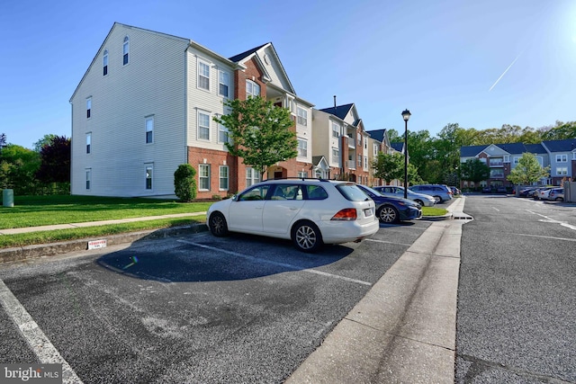 exterior space with street lighting, a residential view, and sidewalks