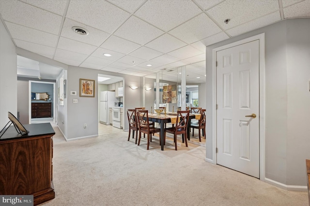 carpeted dining area with recessed lighting, a paneled ceiling, visible vents, and baseboards