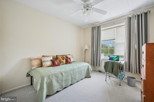 carpeted bedroom with baseboards and ceiling fan