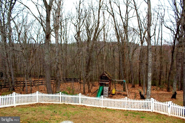 6 Copewood Ct, Manchester, MD 21102 - view of yard featuring a wooded view, fence, and a playground