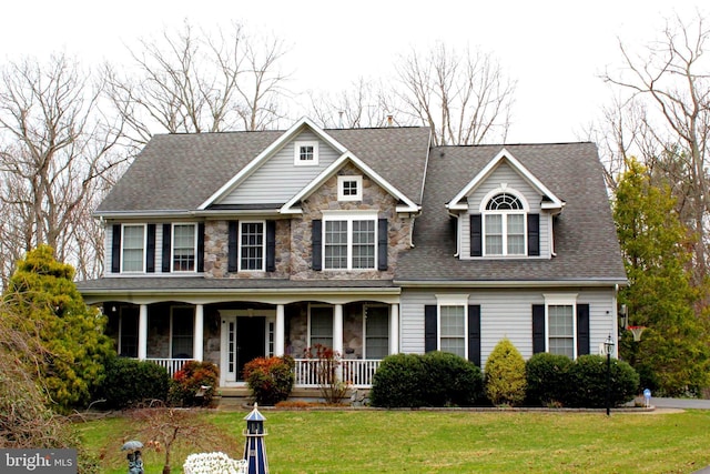 6 Copewood Ct, Manchester, MD 21102 - craftsman inspired home featuring a porch, roof with shingles, a front yard, and stone siding