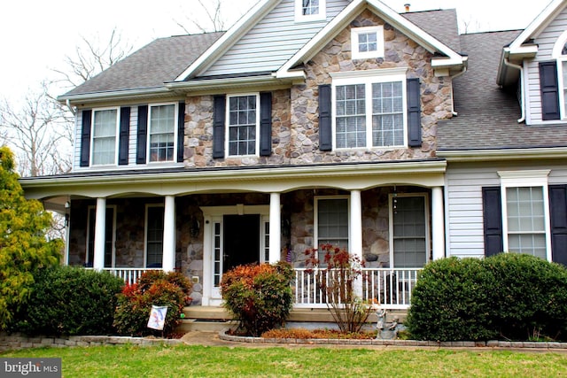 6 Copewood Ct, Manchester, MD 21102 - view of front facade with a porch, roof with shingles, and stone siding