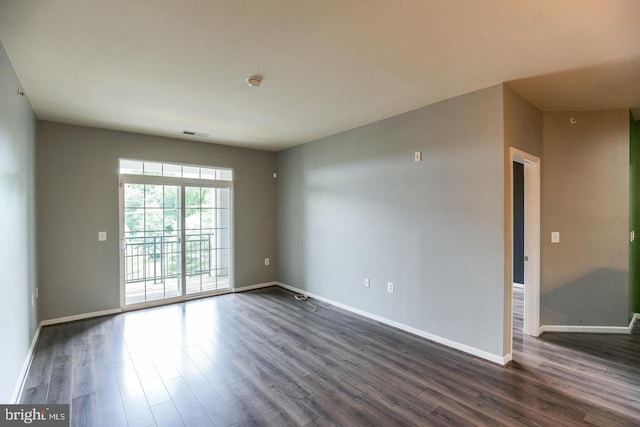 1341 Karen Blvd Unit 404, Capitol Heights, MD 20743 - spare room with dark wood-style floors and baseboards