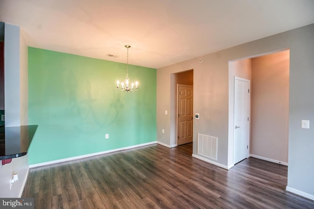 1341 Karen Blvd Unit 404, Capitol Heights, MD 20743 - unfurnished dining area with a chandelier, dark wood-style floors, and baseboards