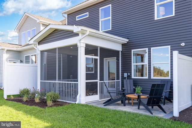 370 Scranton Ln, Ocean View, DE 19970 - rear view of property with a sunroom, fence, a yard, and a patio area