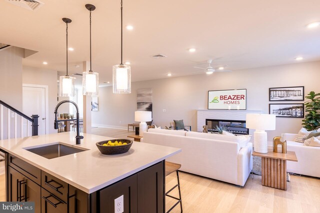 370 Scranton Ln, Ocean View, DE 19970 - kitchen featuring open floor plan, light countertops, a sink, visible vents, and a ceiling fan