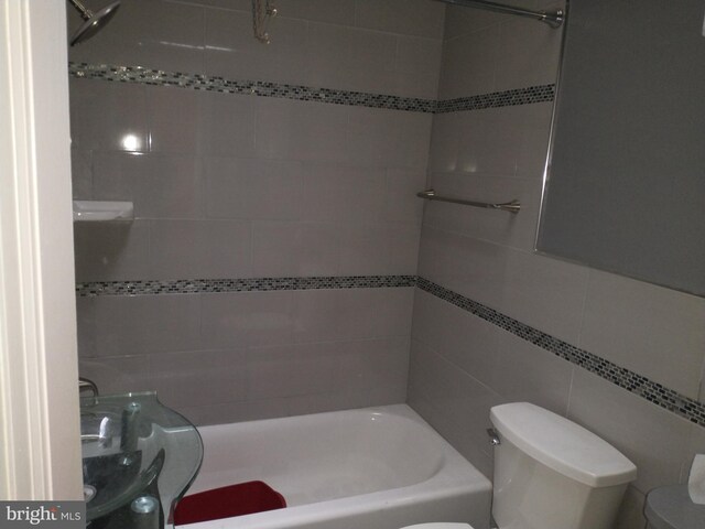 6812 Sprague St, Philadelphia, PA 19119 - full bathroom featuring tile walls, toilet, and shower / bath combination