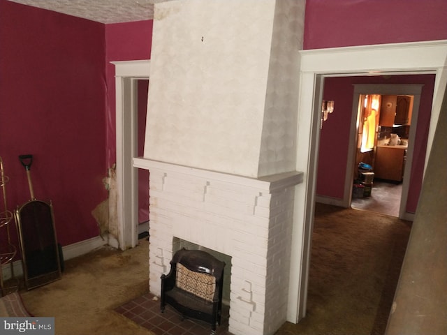 6812 Sprague St, Philadelphia, PA 19119 - carpeted living area featuring a fireplace, baseboards, and a textured ceiling