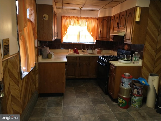 6812 Sprague St, Philadelphia, PA 19119 - kitchen with a sink, light countertops, black gas stove, under cabinet range hood, and backsplash