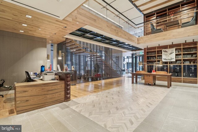 building lobby with a towering ceiling and stairway
