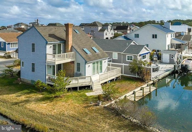 10429 Brighton Rd, Ocean City, MD 21842 - rear view of house with a residential view, a chimney, and a yard
