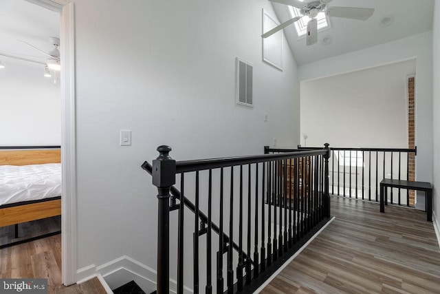 10429 Brighton Rd, Ocean City, MD 21842 - stairs with a ceiling fan, wood finished floors, lofted ceiling, baseboards, and attic access