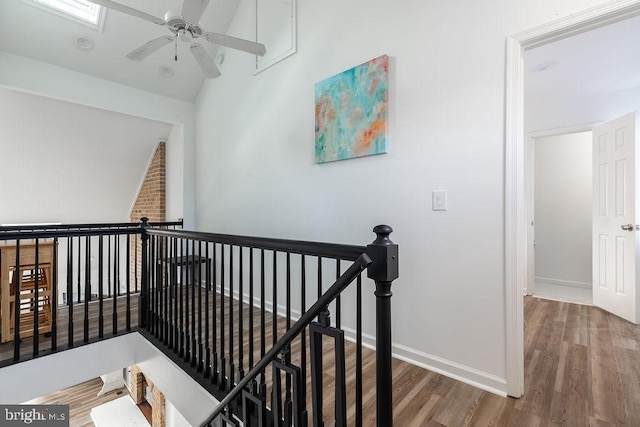 10429 Brighton Rd, Ocean City, MD 21842 - corridor with an upstairs landing, wood finished floors, baseboards, and lofted ceiling