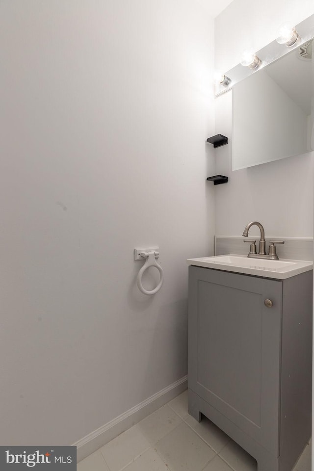 10429 Brighton Rd, Ocean City, MD 21842 - bathroom with baseboards, vanity, and tile patterned flooring