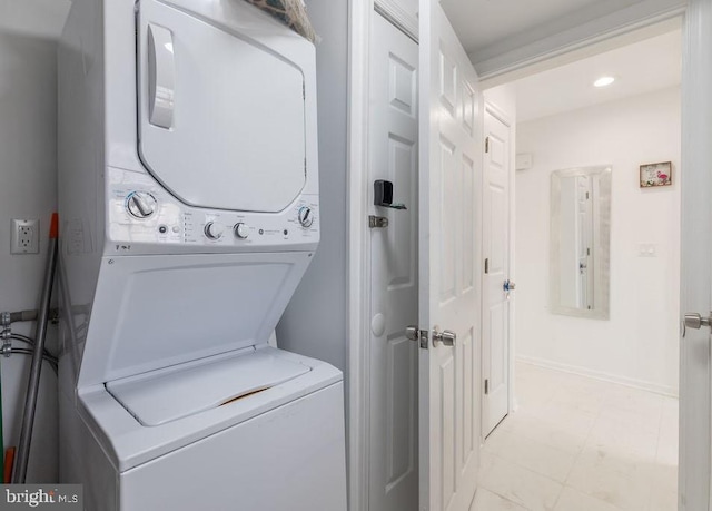10429 Brighton Rd, Ocean City, MD 21842 - laundry room featuring stacked washer / drying machine and light floors