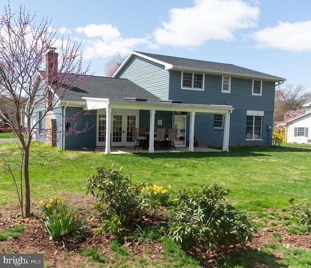 768 Lexington Ave, Hershey, PA 17033 - rear view of property featuring french doors, a lawn, a patio area, a chimney, and brick siding