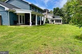 768 Lexington Ave, Hershey, PA 17033 - rear view of house featuring french doors and a lawn