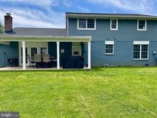 768 Lexington Ave, Hershey, PA 17033 - rear view of house with a yard, a patio area, and a chimney
