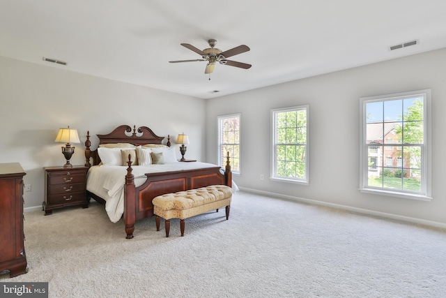 bedroom with carpet flooring, baseboards, and visible vents