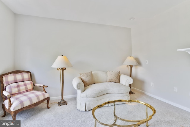 sitting room with carpet floors and baseboards