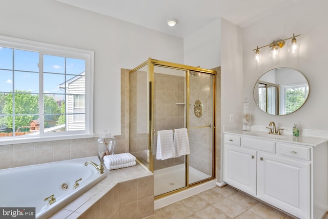 bathroom featuring vanity, tile patterned flooring, a stall shower, and a bath