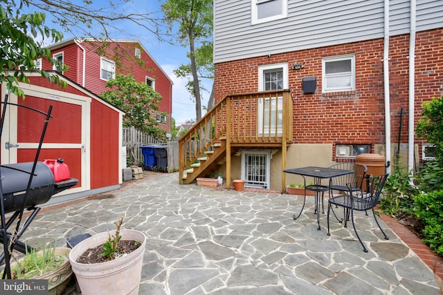 1933 Rollins Dr, Alexandria, VA 22307 - view of patio with a storage shed, stairs, an outdoor structure, outdoor dining space, and a wooden deck