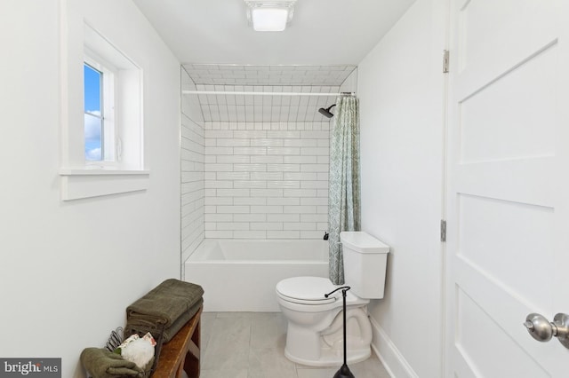 bathroom with shower / bath combo, baseboards, toilet, and tile patterned floors
