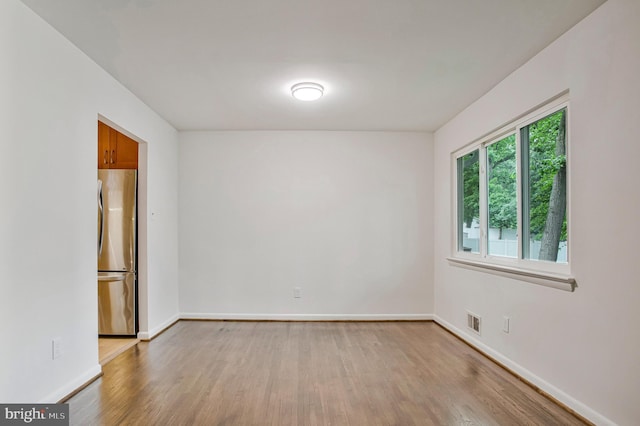 6901 Niles Dr, Laurel, MD 20707 - spare room with light wood-style flooring and baseboards