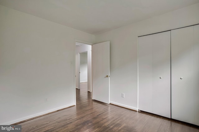 6901 Niles Dr, Laurel, MD 20707 - unfurnished bedroom featuring wood finished floors, a closet, and baseboards