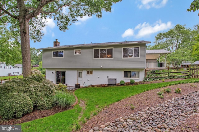 6901 Niles Dr, Laurel, MD 20707 - rear view of house featuring a chimney and central AC unit