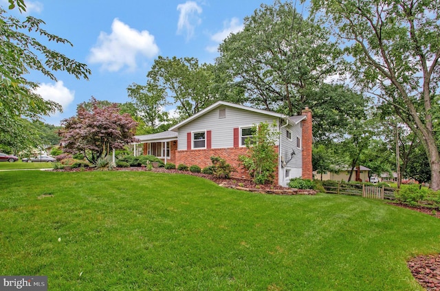 6901 Niles Dr, Laurel, MD 20707 - view of side of property featuring a chimney and brick siding
