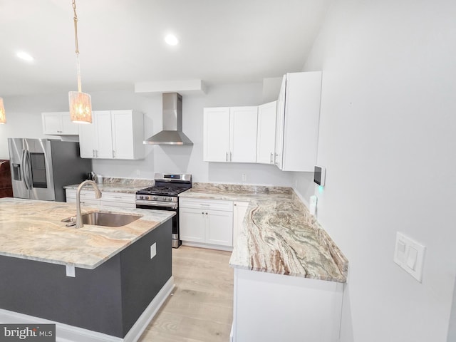 3906 Reisterstown Rd, Baltimore, MD 21215 - kitchen with appliances with stainless steel finishes, wall chimney range hood, a sink, white cabinets, and light stone counters