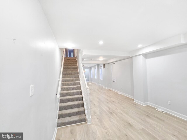 3906 Reisterstown Rd, Baltimore, MD 21215 - finished below grade area featuring light wood finished floors, stairs, baseboards, and recessed lighting