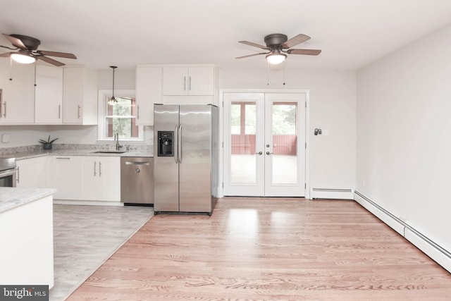 19468 Youngs Cliff Rd, Sterling, VA 20165 - kitchen featuring stainless steel appliances, ceiling fan, french doors, and light wood-type flooring