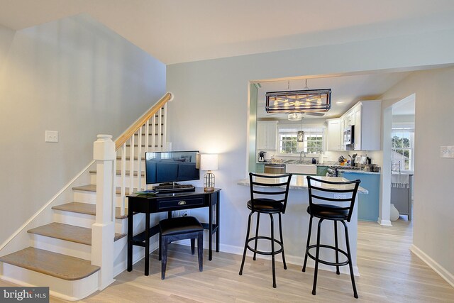 20938 Olen Mattingly Rd, Avenue, MD 20609 - dining space with light wood finished floors, baseboards, and stairs