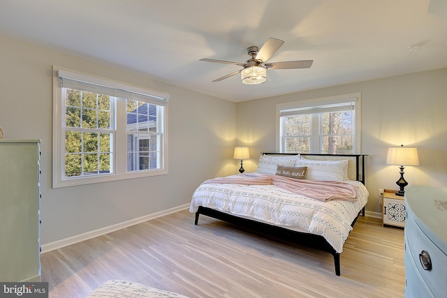 20938 Olen Mattingly Rd, Avenue, MD 20609 - bedroom featuring baseboards, light wood-style flooring, multiple windows, and a ceiling fan