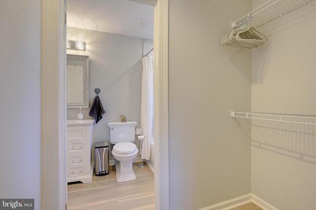 20938 Olen Mattingly Rd, Avenue, MD 20609 - bathroom featuring toilet, baseboards, visible vents, curtained shower, and wood finished floors