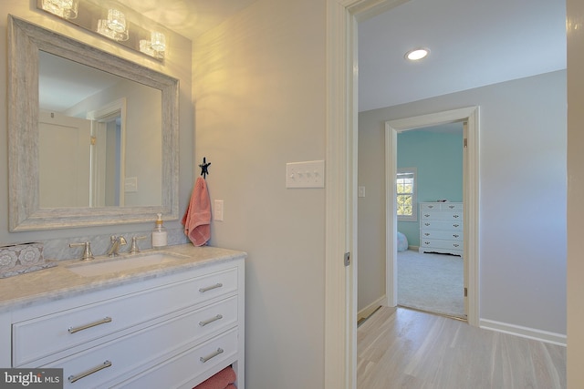 20938 Olen Mattingly Rd, Avenue, MD 20609 - bathroom featuring baseboards, wood finished floors, recessed lighting, and vanity