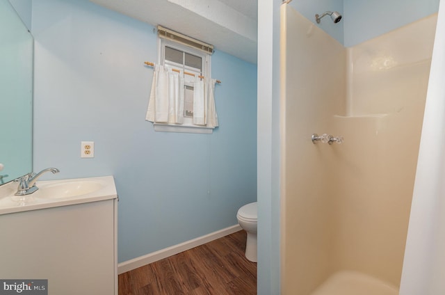 2943 Strathaven Ln, Abingdon, MD 21009 - bathroom with wood finished floors, a stall shower, and vanity
