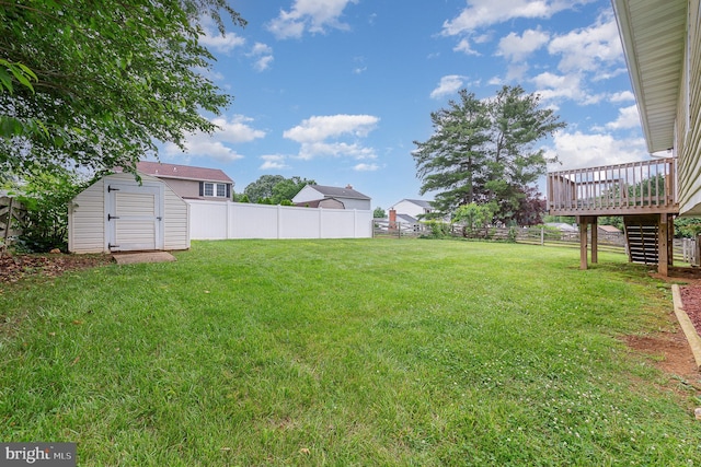 2943 Strathaven Ln, Abingdon, MD 21009 - fenced backyard featuring stairs, a wooden deck, and a storage unit