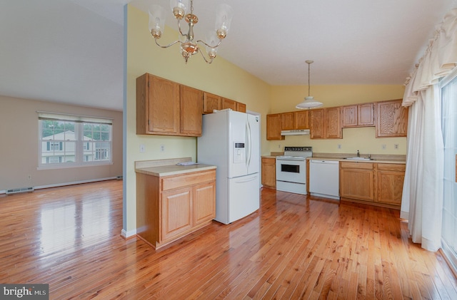 2943 Strathaven Ln, Abingdon, MD 21009 - kitchen with white appliances, vaulted ceiling, light wood-type flooring, light countertops, and pendant lighting
