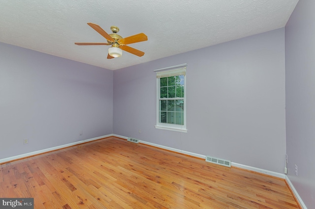 2943 Strathaven Ln, Abingdon, MD 21009 - spare room with wood finished floors, ceiling fan, and a textured ceiling
