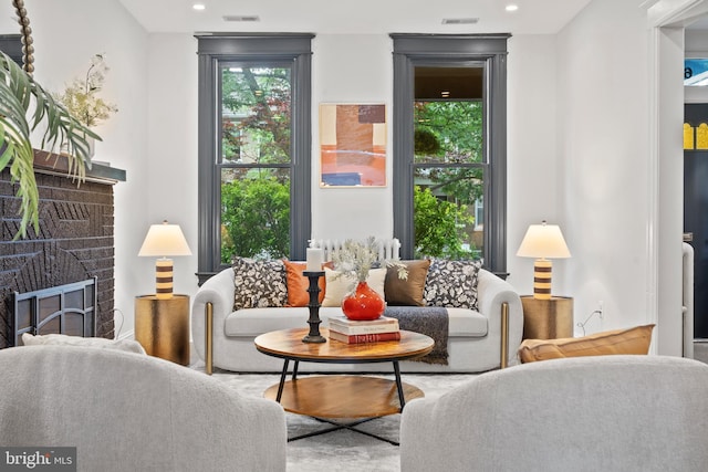 sitting room with a fireplace and recessed lighting