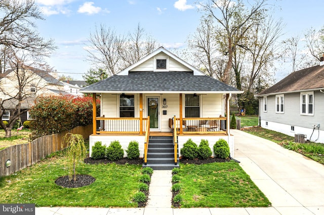 307 Kendall Blvd, Oaklyn, NJ 08107 - bungalow-style house with a front yard, roof with shingles, covered porch, and concrete driveway