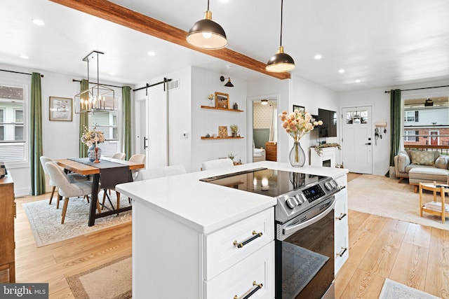 307 Kendall Blvd, Oaklyn, NJ 08107 - kitchen featuring open floor plan, a wealth of natural light, a barn door, and electric stove